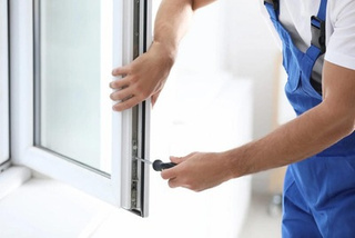 V CARE technician carrying out window repair and maintenance works