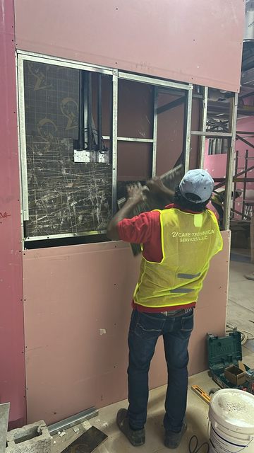 V CARE technician installing partition framing